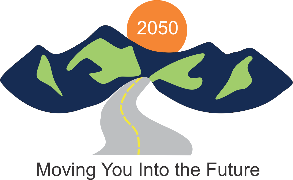 Picture that shows a road going to a highway sign to the mountains with Year 2050 above it.