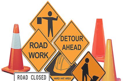 Picture of traffic cones and road construction signs
