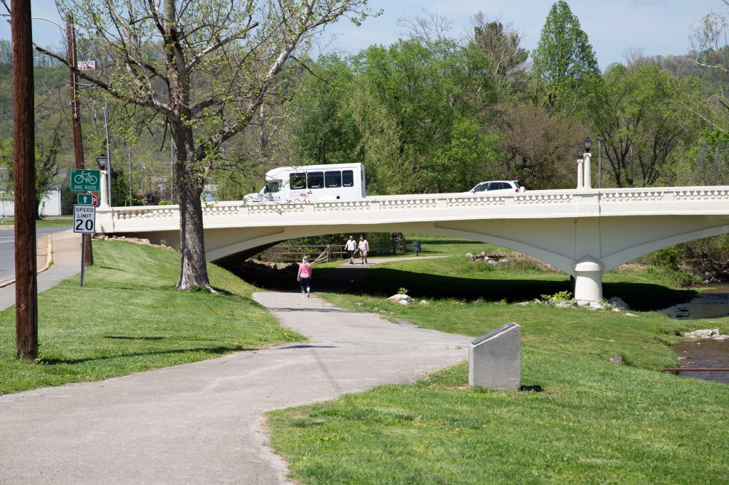 People walking and driving near Elizabethton Linear Trail